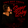 Load image into Gallery viewer, Product label for the 'Sugar Baby' hand-poured soy candle by Two Hot Thots Candle Co., featuring a woman holding a pink heart-shaped lollipop against a black background with red text.